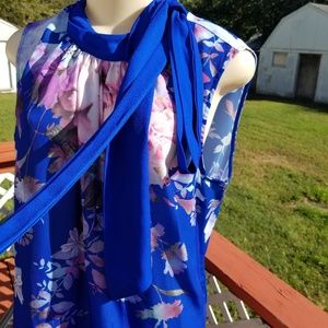 Cute bright blue floral tie neck top